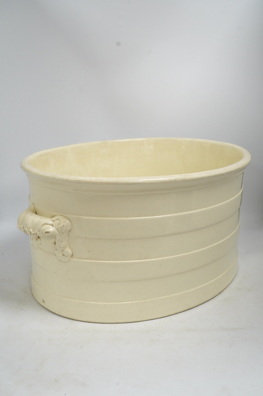A Victorian Copeland & Garrett 'New Fayence' oval two handled footbath, 56cm wide, 26cm high. Condition - fair
